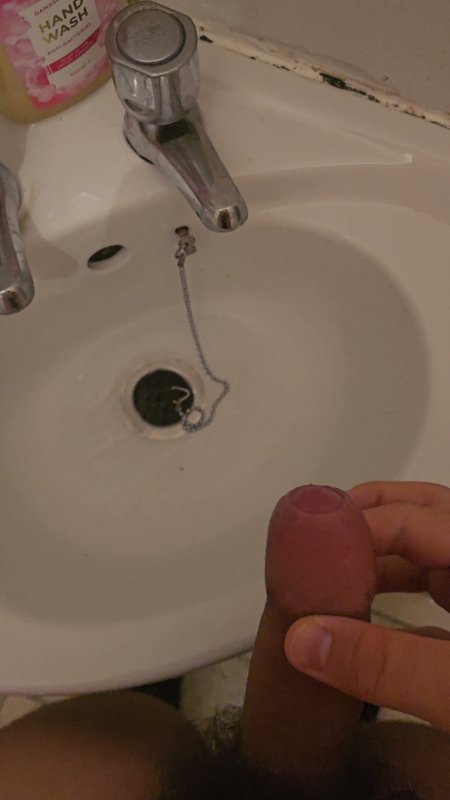 Polish teen washing his dick in a sink